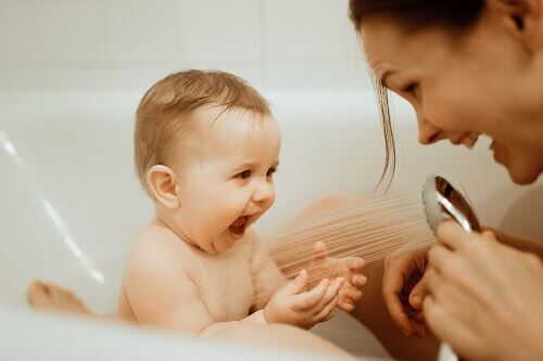 Mother washing baby - custody arrangement